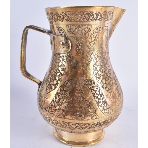 448 - A LARGE TURKISH TOMBAK OTTOMAN STYLE GILDED COPPER ENGRAVED JUG. 25cm high.