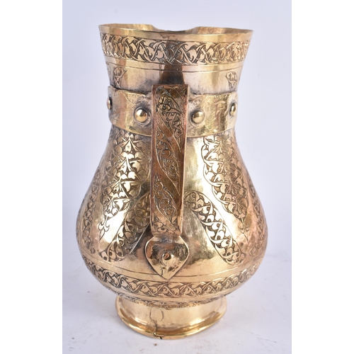 448 - A LARGE TURKISH TOMBAK OTTOMAN STYLE GILDED COPPER ENGRAVED JUG. 25cm high.