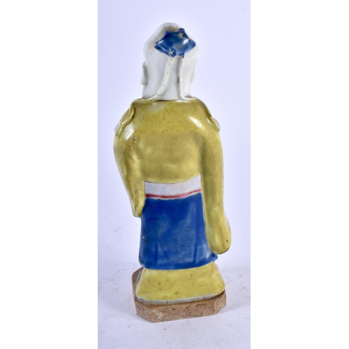 453 - A LATE 18TH/19TH CENTURY CHINESE PORCELAIN FIGURE OF A MALE IMMORTAL modelled in yellow robes. 19 cm... 