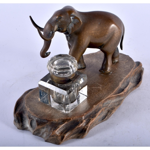 457 - A 19TH CENTURY FRENCH ELEPHANT BRONZE INKWELL upon a Japanese carved wood base. 21 cm x 12 cm.