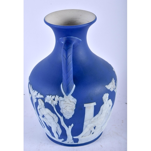 480 - A RARE ANTIQUE WEDGWOOD BLUE JASPERWARE TWIN HANDLED PORTLAND VASE decorated with classical figures.... 