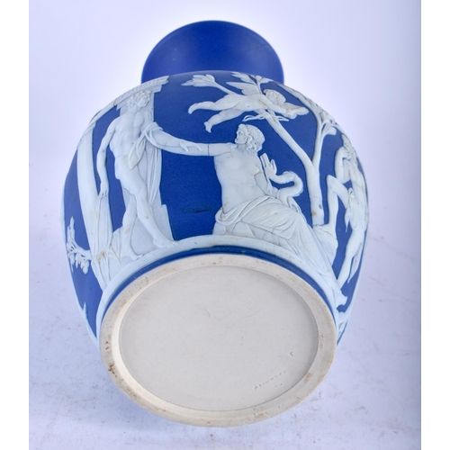 480 - A RARE ANTIQUE WEDGWOOD BLUE JASPERWARE TWIN HANDLED PORTLAND VASE decorated with classical figures.... 