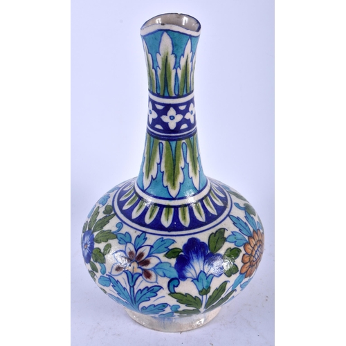 484 - A MIDDLE EASTERN FAIENCE IZNIK TYPE POTTERY EWER painted with flowers. 24 cm high.