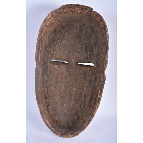 492 - A LARGE AFRICAN TRIBAL CARVED WOOD MASK. 45cm x 20 cm.