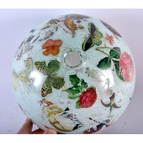 538 - AN ANTIQUE DECLOMANIA GLASS BALL. 25cm wide.