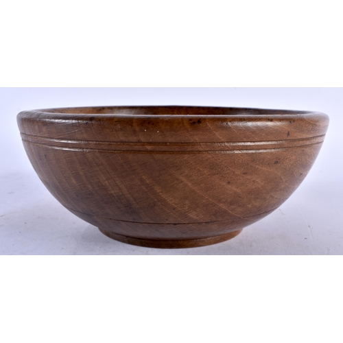 544 - A TREEN BUTTER BOWL. 18 cm diameter.