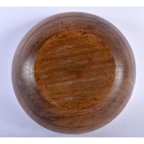 544 - A TREEN BUTTER BOWL. 18 cm diameter.