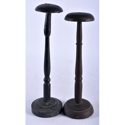 545 - A PAIR OF ANTIQUE MILLINERY HAT STANDS. Largest 29 cm high.