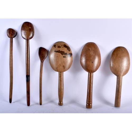 547 - SIX LARGE TREEN DAIRY BUTTER SPOONS. Largest 35 cm long. (6)