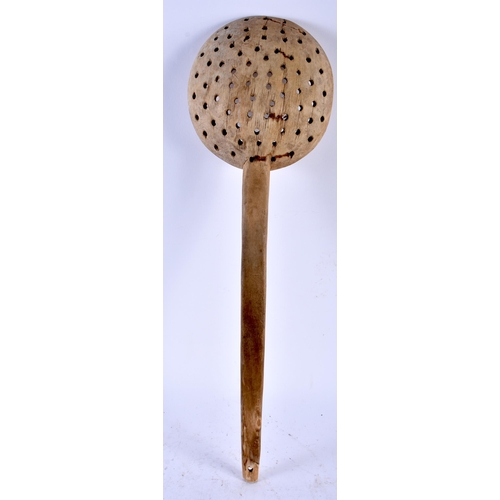 552 - A LARGE TREEN SPOON. 54 cm long.