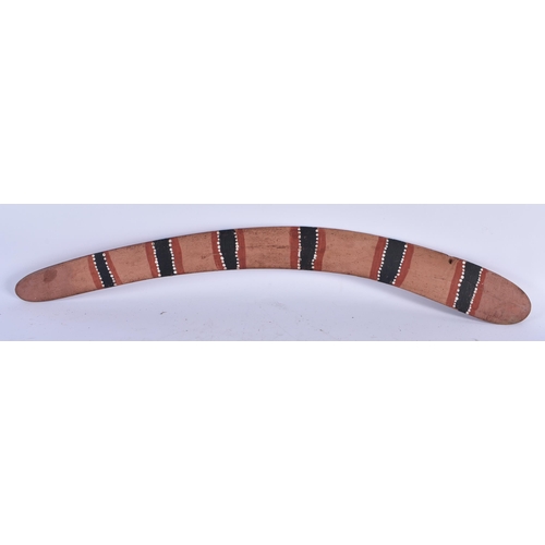 555 - A PAINTED AUSTRALIAN TRIBAL CARVED WOOD BOOMERANG. 74 cm long.