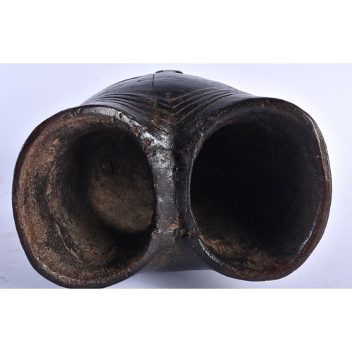 557 - AN AFRICAN TRIBAL CONGOLESE CARRYING MASK WOOD VESSEL. 22cm x 14 cm.