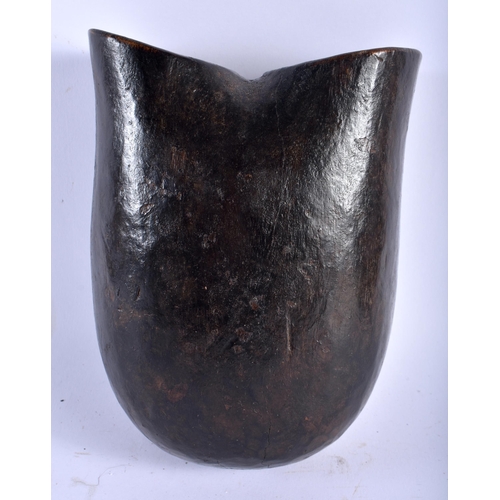 557 - AN AFRICAN TRIBAL CONGOLESE CARRYING MASK WOOD VESSEL. 22cm x 14 cm.