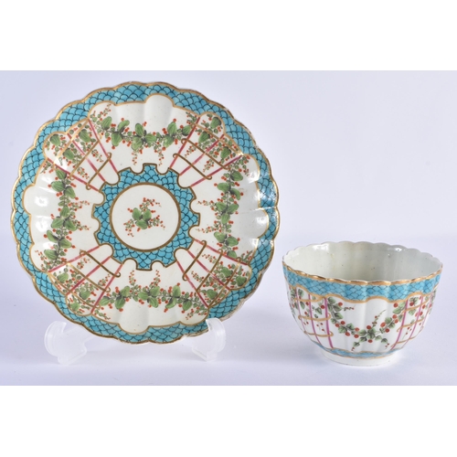 56 - AN 18TH CENTURY WORCESTER FLUTED TEABOWL AND SAUCER painted with trailing flowers under a turquoise ... 