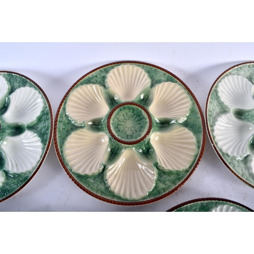 560 - SEVEN 19TH CENTURY FRENCH MAJOLICA OYSTER PLATES. 24 cm diameter. (7)