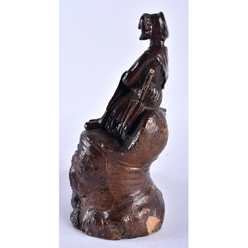 561 - A CHARMING 18TH/19TH CENTURY CONTINENTAL CARVED WOOD MATCH HOLDER formed as a female on a stump. 26 ... 