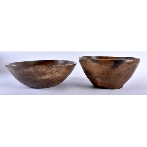 566 - THREE LARGE TREEN WOOD BUTTER BOWLS. Largest 34 cm diameter. (3)