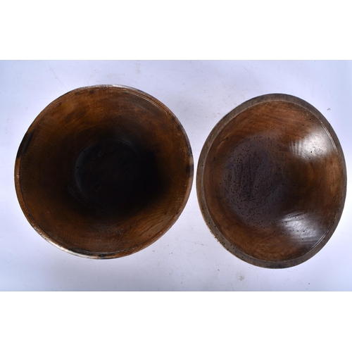 566 - THREE LARGE TREEN WOOD BUTTER BOWLS. Largest 34 cm diameter. (3)