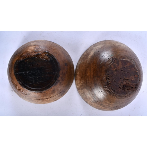 566 - THREE LARGE TREEN WOOD BUTTER BOWLS. Largest 34 cm diameter. (3)