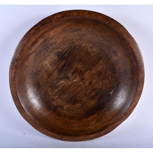 566 - THREE LARGE TREEN WOOD BUTTER BOWLS. Largest 34 cm diameter. (3)