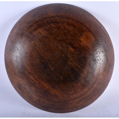 566 - THREE LARGE TREEN WOOD BUTTER BOWLS. Largest 34 cm diameter. (3)