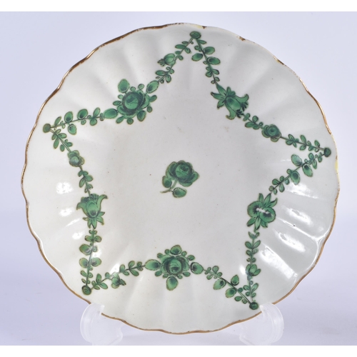 57 - AN 18TH CENTURY WORCESTER RIBBED COFFEE CUP AND SAUCER painted with trailing green flowers. 12 cm wi... 