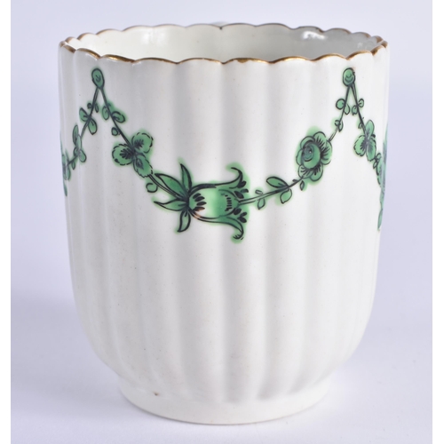 57 - AN 18TH CENTURY WORCESTER RIBBED COFFEE CUP AND SAUCER painted with trailing green flowers. 12 cm wi... 