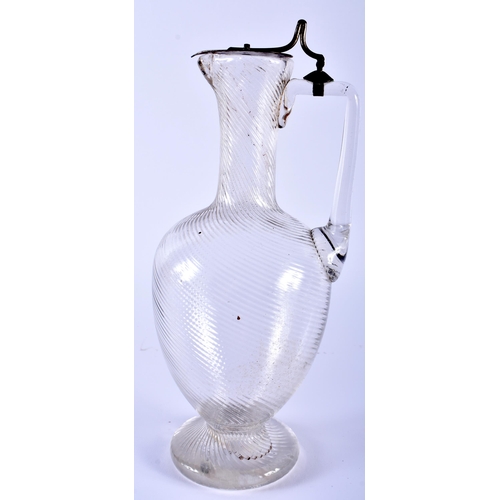 572 - AN ARTS AND CRAFTS SILVER PLATED GLASS CLARET JUG in the manner of Dr Christopher Dresser. 28 cm hig... 