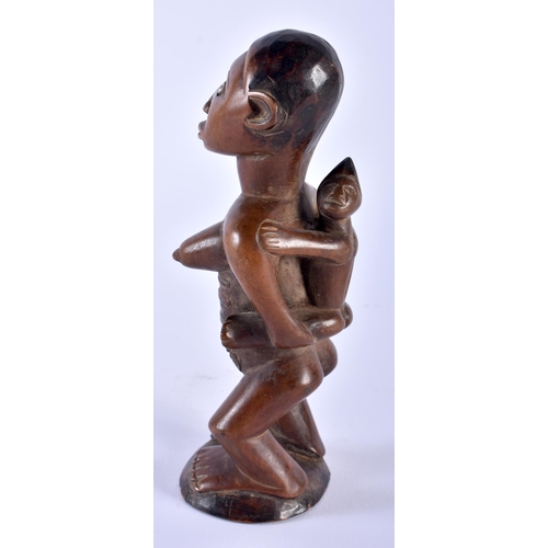 579 - A LOVELY AFRICAN TRIBAL CARVED WOOD FERTILITY FIGURE. 16cm high.