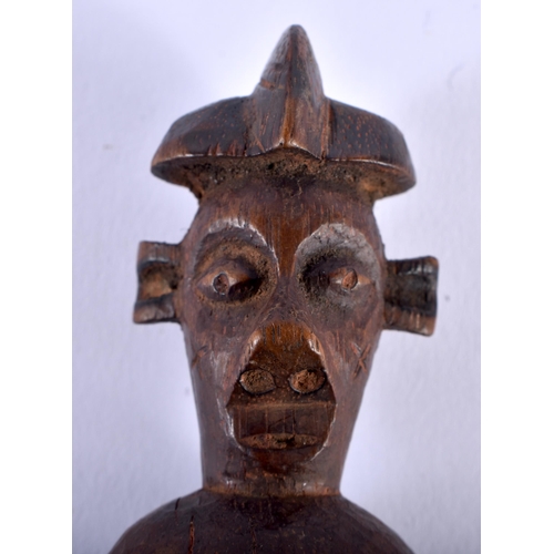 580 - AN AFRICAN TRIBAL CARVED WOOD WHISTLE. 12 cm x 4 cm.