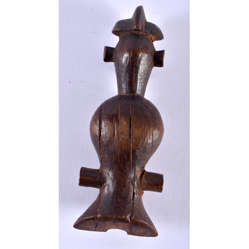 580 - AN AFRICAN TRIBAL CARVED WOOD WHISTLE. 12 cm x 4 cm.