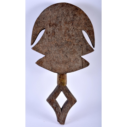 582 - A LARGE TRIBAL BRASS AND COPPER MOUNTED AFRICAN FIGURE. 50cm x 24 cm.