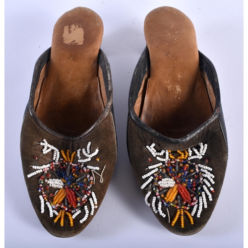 583 - A PAIR OF ANTIQUE BEADWORK SHOES. 24.5 cm long.