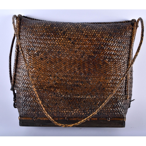 587 - TWO TRIBAL WICKER BAGS. Largest 30 cm x 34 cm. (2)