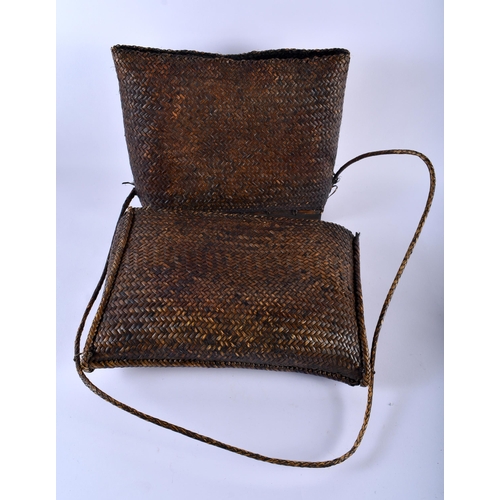 587 - TWO TRIBAL WICKER BAGS. Largest 30 cm x 34 cm. (2)