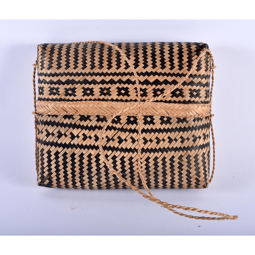 587 - TWO TRIBAL WICKER BAGS. Largest 30 cm x 34 cm. (2)