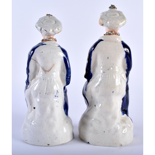 588 - A PAIR OF ANTIQUE STAFFORDSHIRE POTTERY FIGURES OF TURKS. 19 cm high.