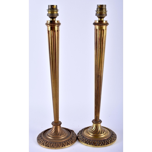 589 - A LARGE PAIR OF ANTIQUE BRONZE CANDLESTICK LAMPS of tapering form. 38 cm high.