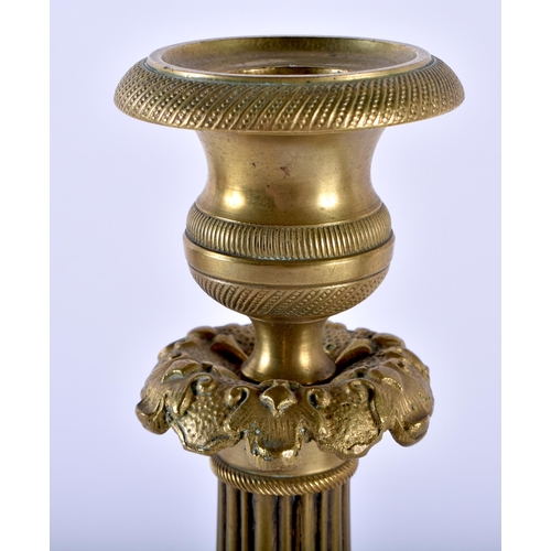 590 - A PAIR OF 19TH CENTURY FRENCH EMPIRE STYLE BRONZE CANDLESTICKS overlaid with acanthus. 27 cm high.