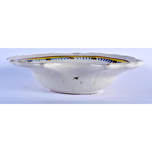 591 - AN ANTIQUE FRENCH FAIENCE BARBERS BOWL. 30 cm x 24 cm.