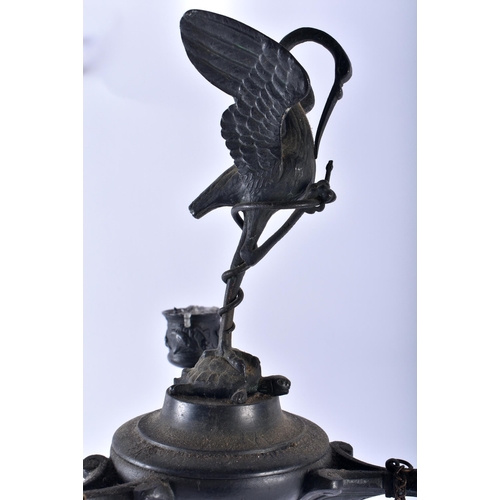 597 - A LARGE PAIR OF EARLY 19TH CENTURY FRENCH BRONZE CANDLESTICKS After the Antiquity. 62 cm high.