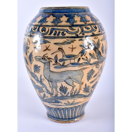 599 - A LARGE 19TH CENTURY PERSIAN ISLAMIC BLUE GLAZED VASE painted with animals and scripture. 30 cm x 18... 