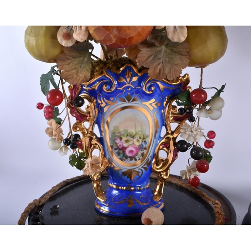 600 - A LARGE PAIR OF 19TH CENTURY FRENCH PORCELAIN FAUX FRUIT SCULPTURES with glass domes. 54 cm high.