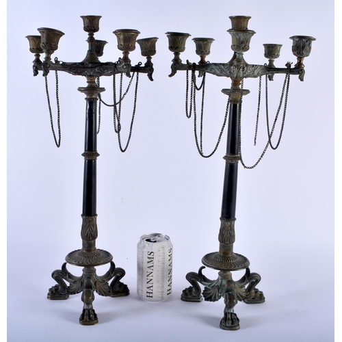 604 - A PAIR OF 19TH CENTURY FRENCH EMPIRE STYLE BRONZE CANDLESTICKS. 48cm x 18 cm.