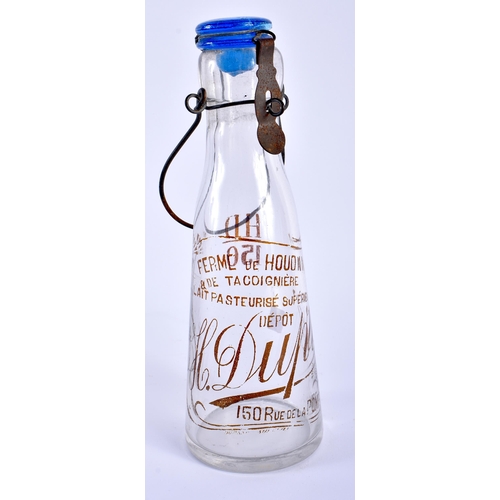 606 - A FRENCH GLASS ADVERTISING MILK BOTTLE. 30 cm high inc handle.