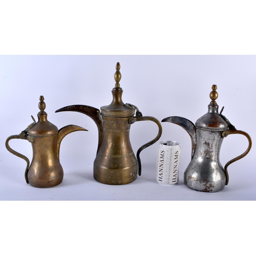 608 - THREE 19TH CENTURY MIDDLE EASTERN ISLAMIC EWERS in various forms and sizes. Largest 34 cm x 22cm. (3... 