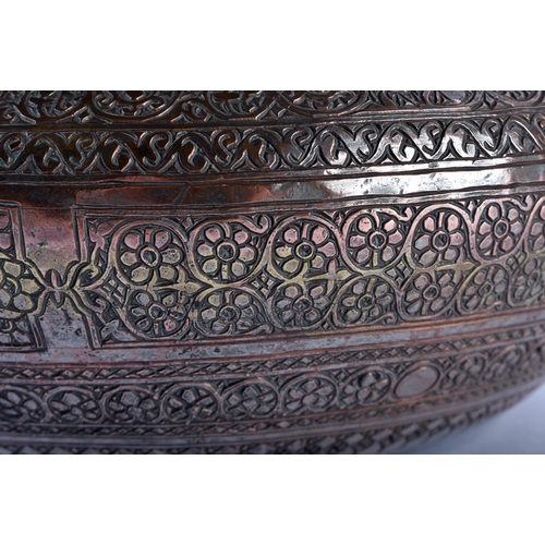 614 - A 19TH CENTURY MIDDLE EASTERN ISLAMIC TINNED COPPER BOWL possibly Syrian, decorated with bands of fo... 