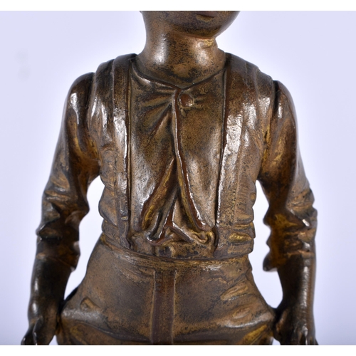 618 - AN ART DECO SPELTER FIGURE OF A BOY. 20 cm high.