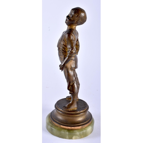 618 - AN ART DECO SPELTER FIGURE OF A BOY. 20 cm high.