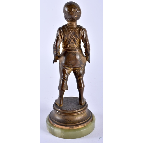 618 - AN ART DECO SPELTER FIGURE OF A BOY. 20 cm high.